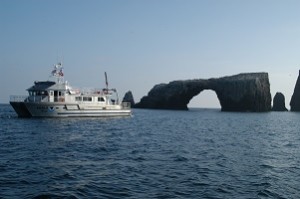 R/V Shearwater anchored next to Anacapa Island arch. Photo by Robert Schwemmer, NOAA ONMS.
