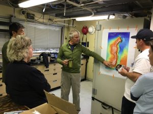 Dr. Jim Barry of MBARI briefs the science crew on today's dive plan. (Photo by Dr. Andrew DeVogelaere, NOAA/MBNMS)